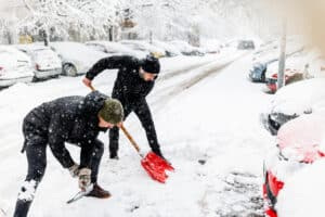 prevent back injuries with proper snow shoveling technique