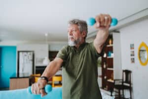 man performing at-home physical therapy exercises