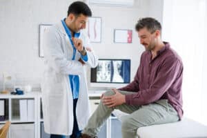 man with knee replacement complications
