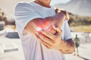 man with osteoarthritis joint pain in his shoulder